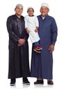 Three generations of smiles. Studio portrait of the male members of a muslim family isolated on white. Royalty Free Stock Photo