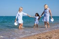 Three generations of women on the beach Royalty Free Stock Photo