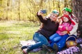 Three generations of women. Beautiful granny, mother and daughter are doing selfie and smiling while sitting on couch at home