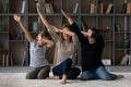 Three generations of women dab dance together