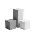 Three geometric rectangular prism shapes of varying sizes arranged together isolated on white background Royalty Free Stock Photo