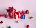 Three gift boxes and many colored balls. Royalty Free Stock Photo