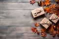Three gift boxes and maple leaves on wooden table, top view, Thanksgiving and autumn background. Generative AI Royalty Free Stock Photo