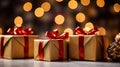 three gift boxes with red bows on a table