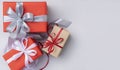 Three gift boxes with ribbons and bows on light grey background Royalty Free Stock Photo