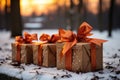 Three gift boxes on the snow in the park. Christmas banner, New Year card