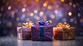 three gift boxes on a table with lights in the background