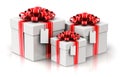 Three gift or present boxes with ribbon bows and label tags