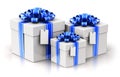 Three gift or present boxes with ribbon bows and label tags