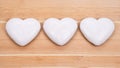 Three gingerbread hearts on wooden background Royalty Free Stock Photo