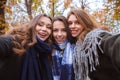 Three girlfriends making selfie photo on camera Royalty Free Stock Photo