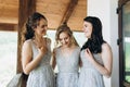 Three girls on the balcony in long dresses. Bridesmaids Royalty Free Stock Photo