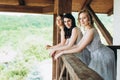 Three girls on the balcony in long dresses. Bridesmaids Royalty Free Stock Photo