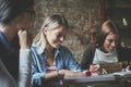 Three girls in cafe having fun. Royalty Free Stock Photo