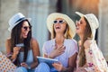 Girls with colorful shopping bags using digital tablet and credit card Royalty Free Stock Photo