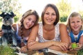 Three girls and a dog Royalty Free Stock Photo