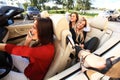 Three girls driving in a convertible car and having fun. Royalty Free Stock Photo