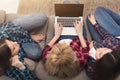 Three girls with laptop computer top view Royalty Free Stock Photo