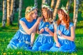 Three girls on the lawn in equally clothes