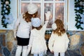 Three girls near a Christmas Royalty Free Stock Photo