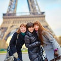 Three girls near the Eiffel tower