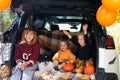 Kids dog celebrating Halloween in car trunk. Autumn holidays Royalty Free Stock Photo