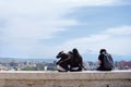 Three girls are sitting at the famous place Cascade in Yerevan, Armenia