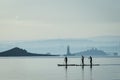 Three girls on stand up paddle board in Scotland Royalty Free Stock Photo