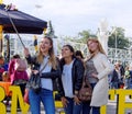 Three girls taking a selfie in a city park