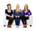 Three girls teen sitting on the couch Royalty Free Stock Photo