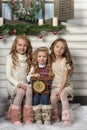 Three cute girls waiting for Christmas Royalty Free Stock Photo