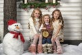 Three cute girls waiting for Christmas Royalty Free Stock Photo