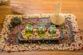 Three glass bottles with aromatic oils and spice on the wooden table