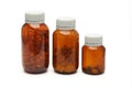 Three glass bottles of medicines