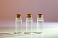 Three glass corked bottles filled with liquid. Background for science and medicine. Virus vaccine Royalty Free Stock Photo