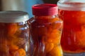 Three glass jars with apple jam close-up. Home canning. Delicious dessert for tea. Cooking. Vertical photo Royalty Free Stock Photo