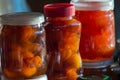 Three glass jars with apple jam close-up. Home canning. Delicious dessert for tea. Cooking. Vertical photo Royalty Free Stock Photo