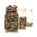 Three glass jars filled with American coins Royalty Free Stock Photo