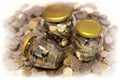 Three glass jars full of coins Royalty Free Stock Photo