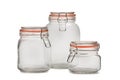 Three glass jars with tight-fitting lids for bulk products on a white background.