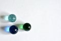 three glass marbles on white background Royalty Free Stock Photo