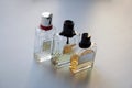Three glass perfume bottles on white background Royalty Free Stock Photo