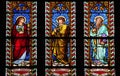 Three glass stained windows in church Royalty Free Stock Photo