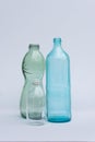 Three glass water bottles isolated on white. Ecologic, sustainability and plastic free