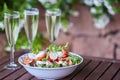 Three glassed of champagne and fresh salad - close up Royalty Free Stock Photo