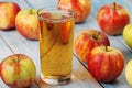 Glasses with apple juice and ripe apples Royalty Free Stock Photo