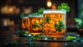 Three glasses of beer with clovers on top Royalty Free Stock Photo