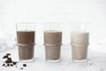 three glasses with chocolate milkshakes, front view Royalty Free Stock Photo