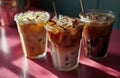 three glasses of coffees in a pink background