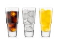 Three glasses with cola soft drink with orange soda and lemonade with ice cubes on white Royalty Free Stock Photo